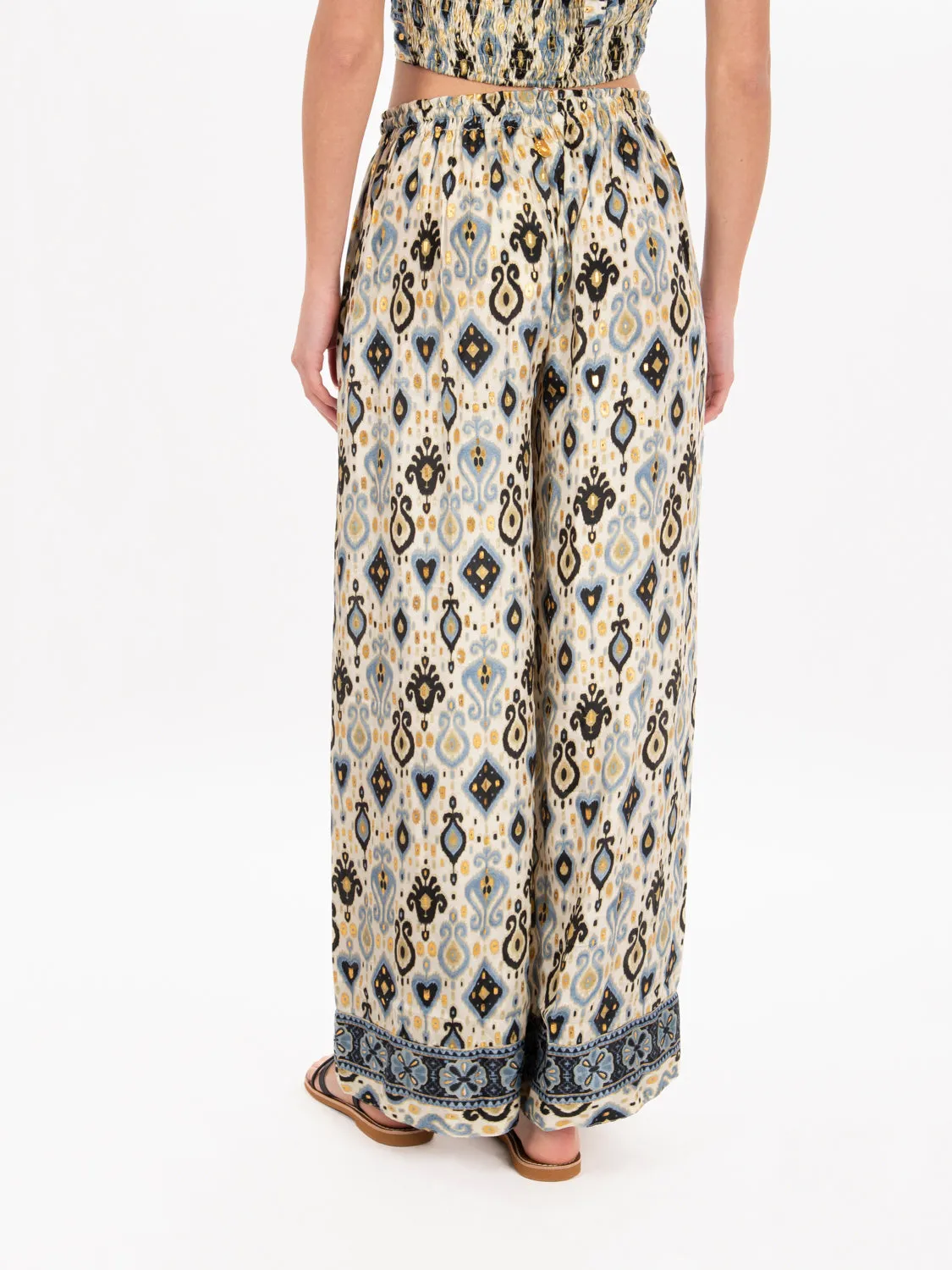 Pantaloni palazzo con nappine multicolor